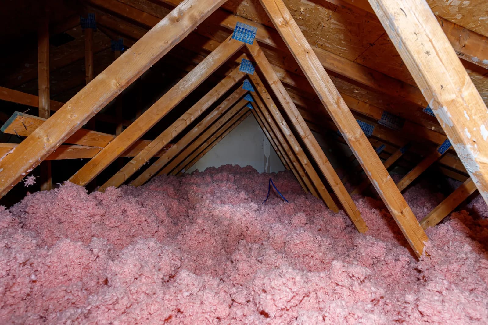 Blown-in insulation filling an attic floor