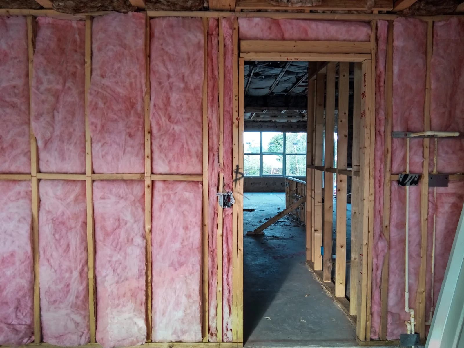 Batt insulation installed in open wall cavities